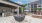 The outdoor lounge at our retirement in Lakewood Ranch, FL, featuring a shade structure and a fire pit.